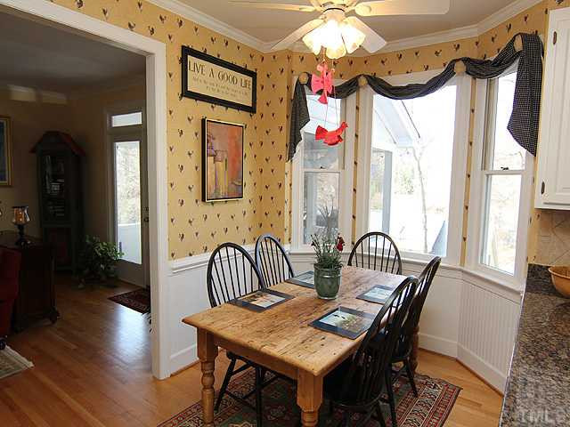 2512 Ashley Court Raleigh, NC 27607 - Photo 10 of 24 Spacious breakfast area overlooking the back yard - chair rail and white beadboard create current comfortable look. Breakfast Area
