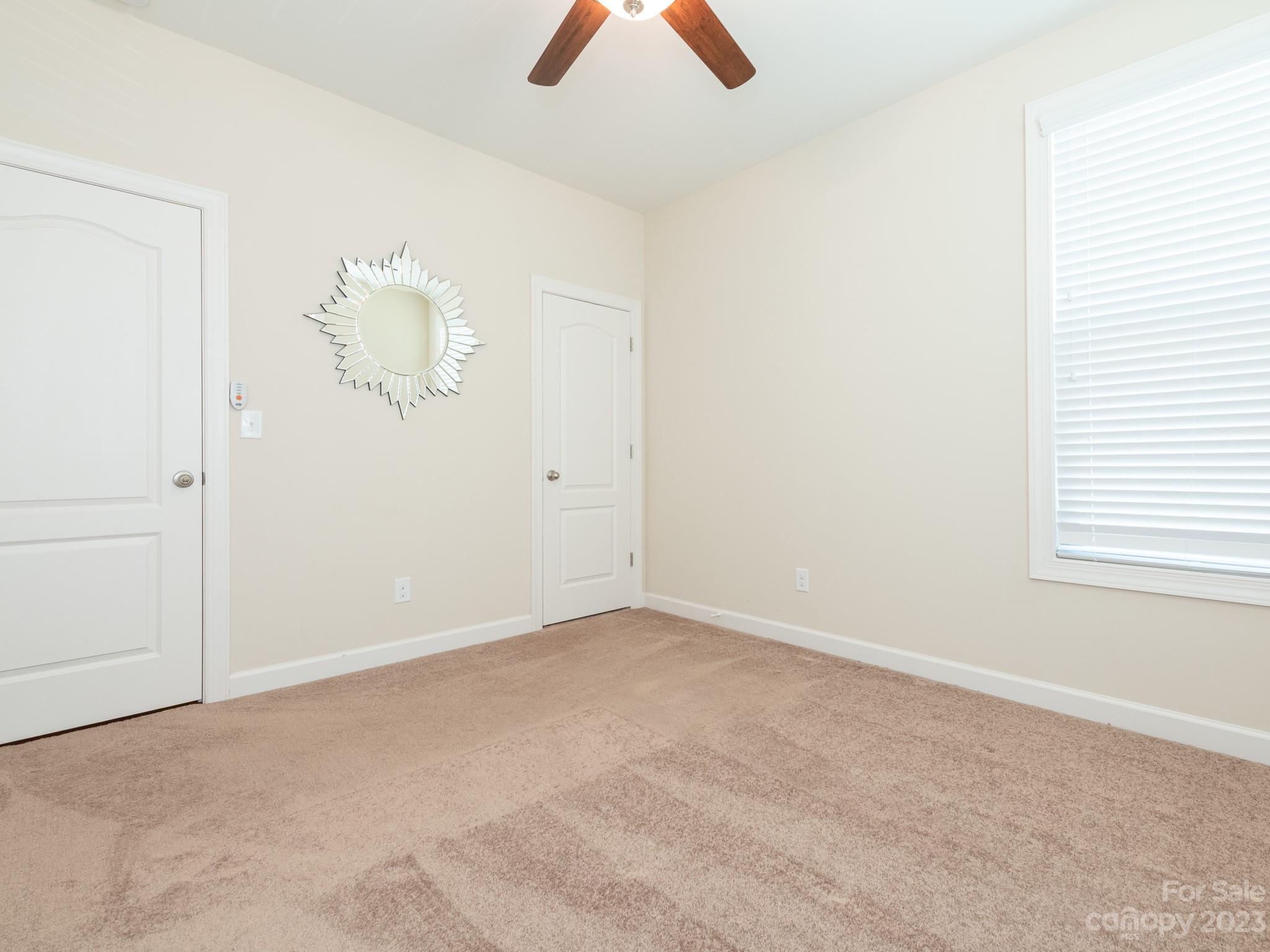 1320 Cilantro Court Tega Cay, SC 29708 - Photo 8 of 40 an empty room with windows