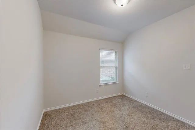 an empty room with closet area