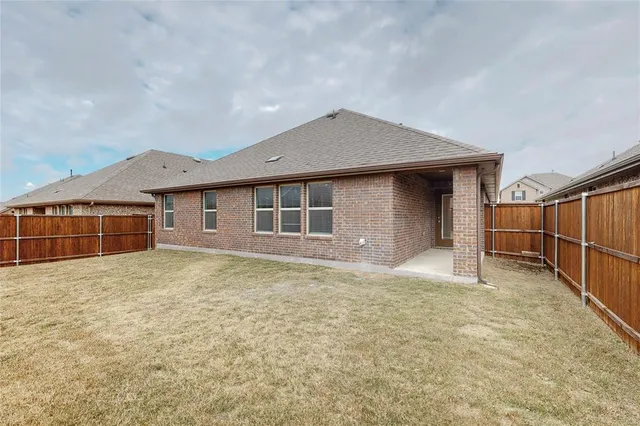a house with yard in front of it