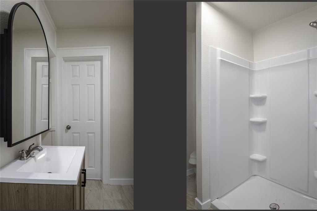 628 South Westmoreland Road Dallas, TX 75211 - Photo 14 of 19 a bathroom with a sink a toilet and a mirror