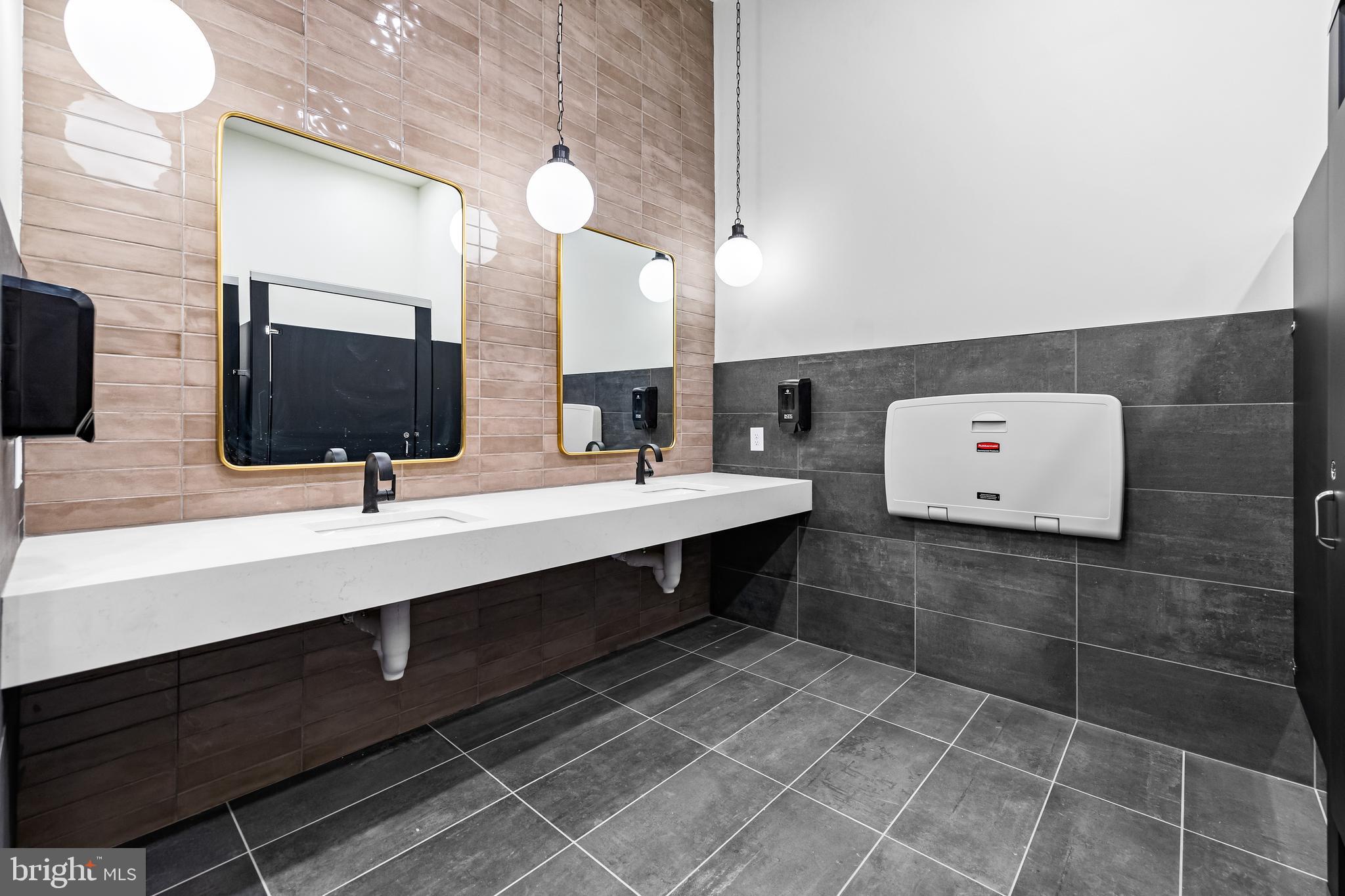 1201 Walnut Bottom Road, Unit 81201 Carlisle, PA 17015 - Photo 31 of 33 a bathroom with a double vanity sink a mirror and a bathtub