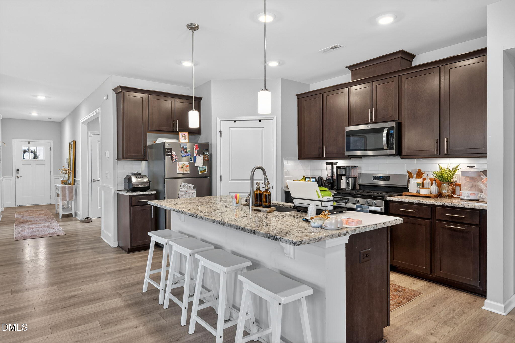 1519 Nichols Crk Road Durham, NC 27703 - Photo 13 of 22 a kitchen with stainless steel appliances granite countertop a sink stove and refrigerator