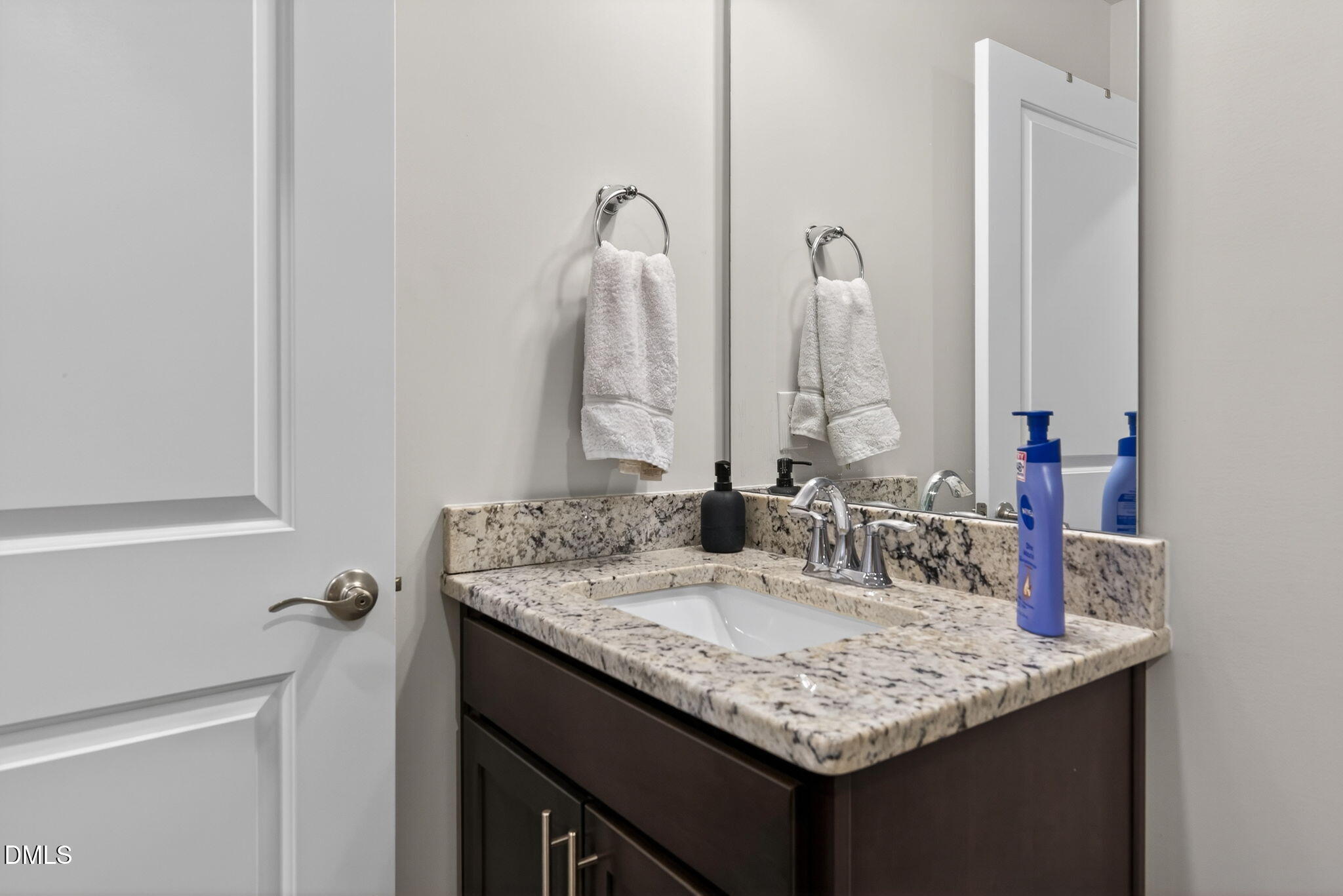 1519 Nichols Crk Road Durham, NC 27703 - Photo 19 of 22 a bathroom with a granite countertop sink and a mirror