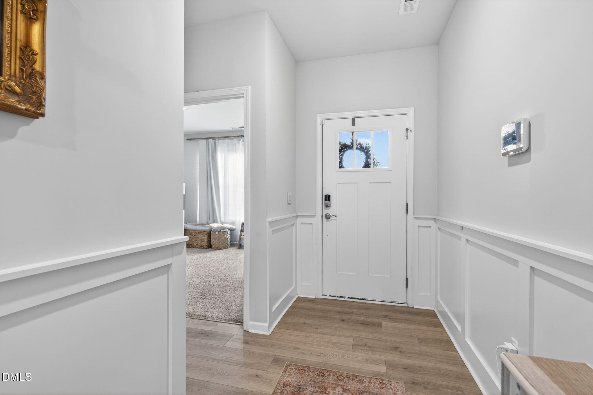 1519 Nichols Crk Road Durham, NC 27703 - Photo 5 of 22 a view of a hallway with wooden floor and closet
