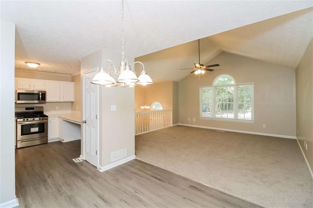 133 Johnstons Way Dallas, GA 30132 - Photo 4 of 15 a view of a kitchen with a sink and a stove