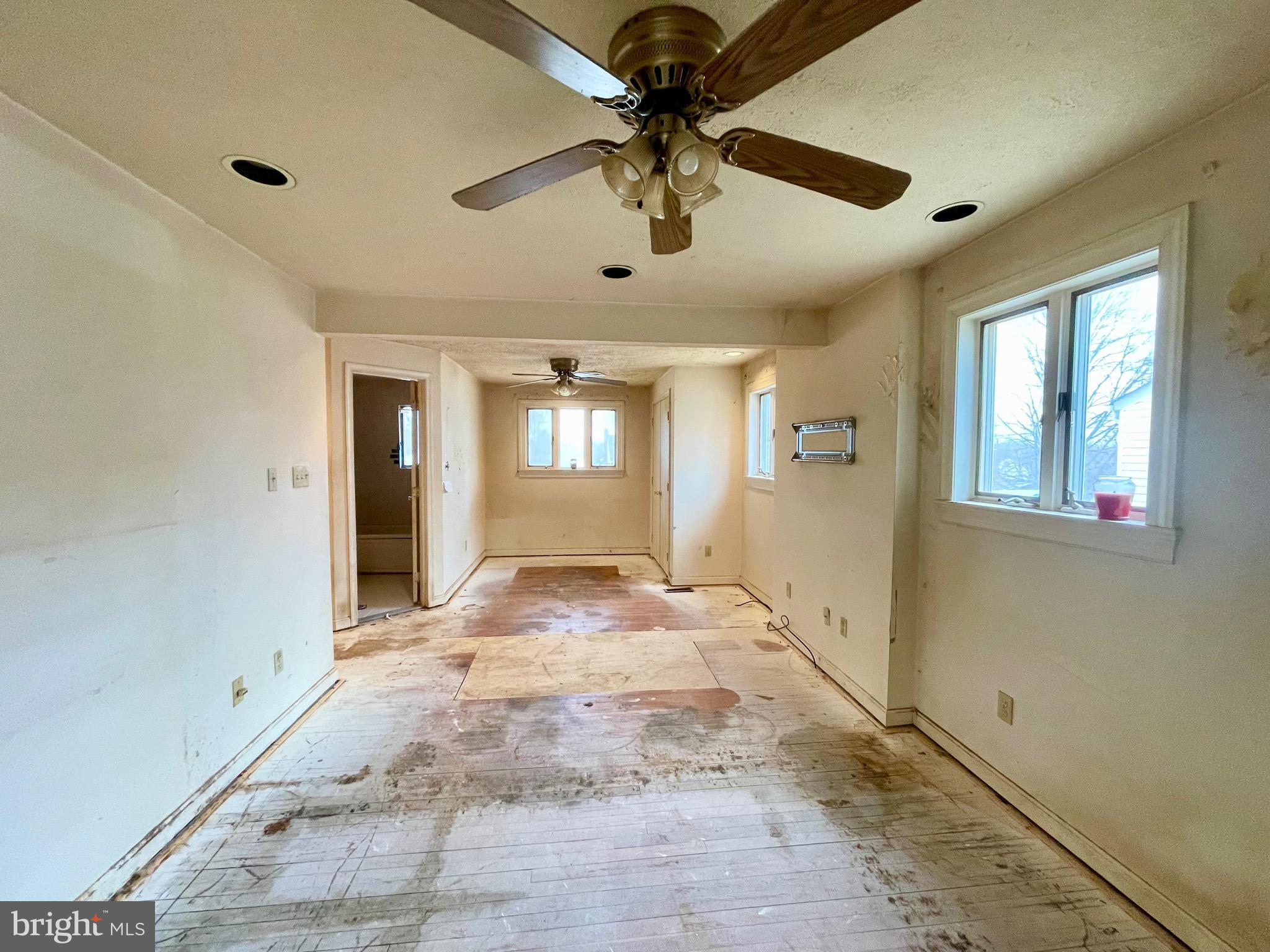 12420 Feldon Street Silver Spring, MD 20906 - Photo 11 of 33 a view of a livingroom with a chandelier fan and windows