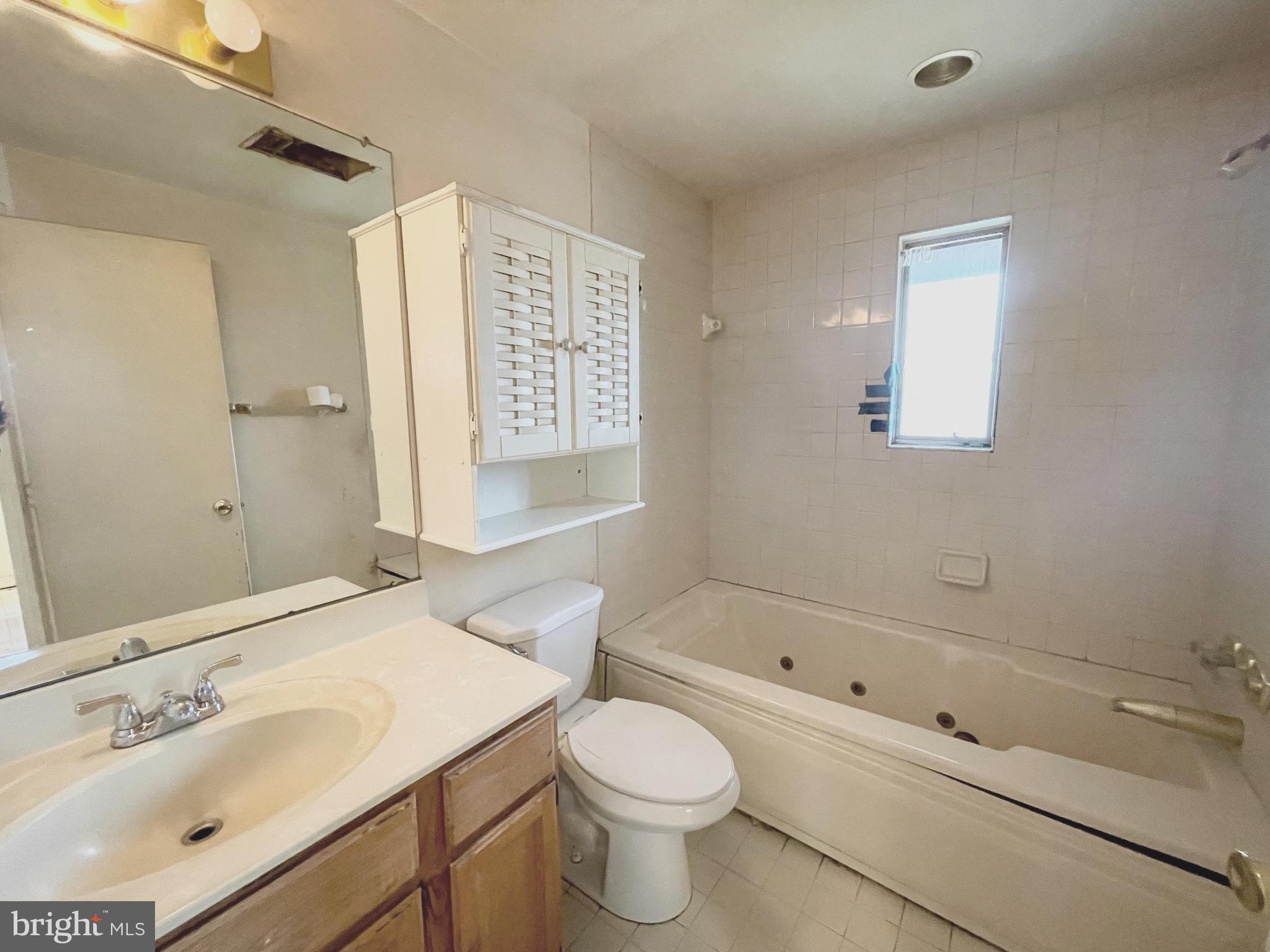 12420 Feldon Street Silver Spring, MD 20906 - Photo 13 of 33 a bathroom with a sink toilet and shower