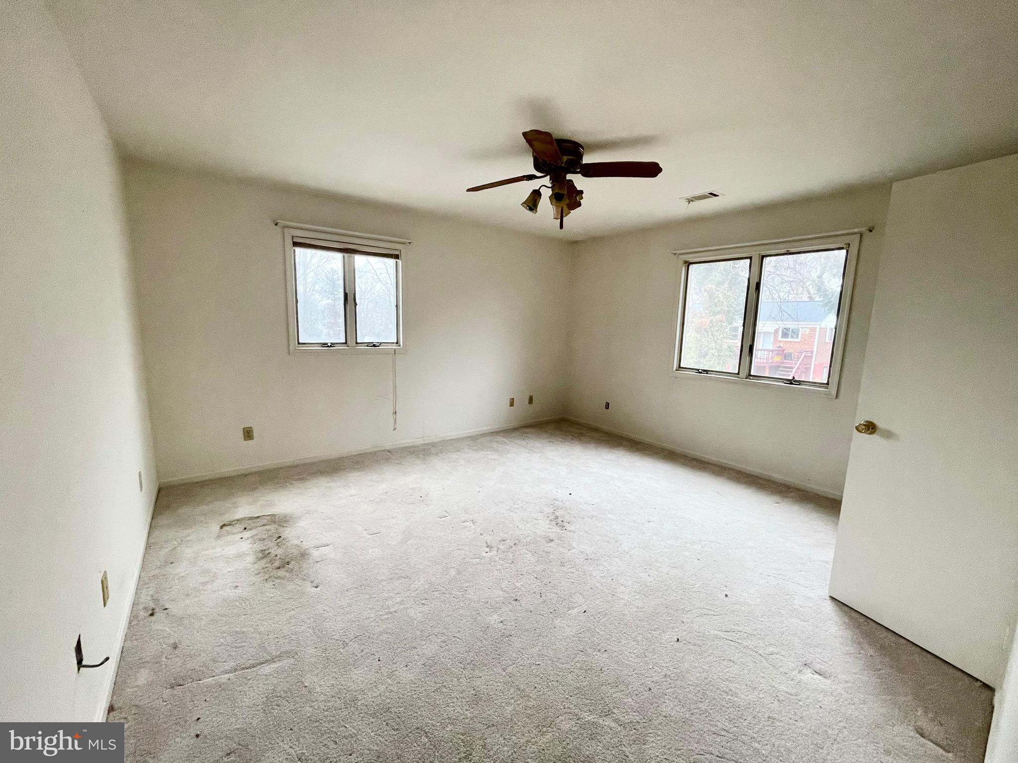 12420 Feldon Street Silver Spring, MD 20906 - Photo 18 of 33 an empty room with windows and fan