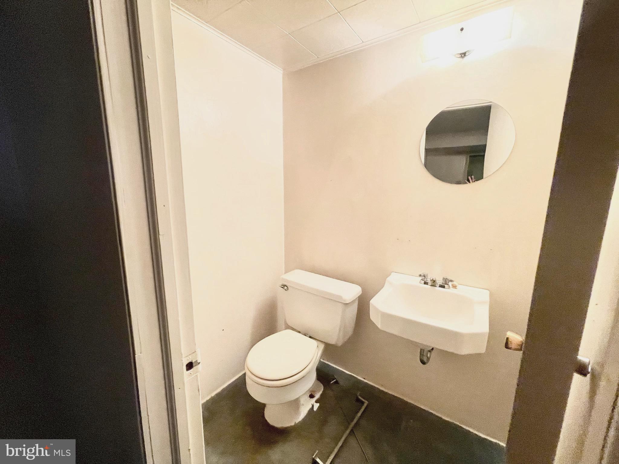 12420 Feldon Street Silver Spring, MD 20906 - Photo 26 of 33 a white toilet sitting next to a shower curtain