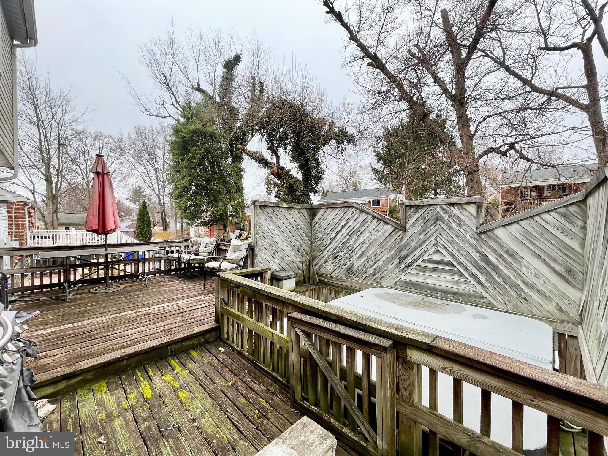 12420 Feldon Street Silver Spring, MD 20906 - Photo 29 of 33 a balcony with wooden floor and outdoor seating