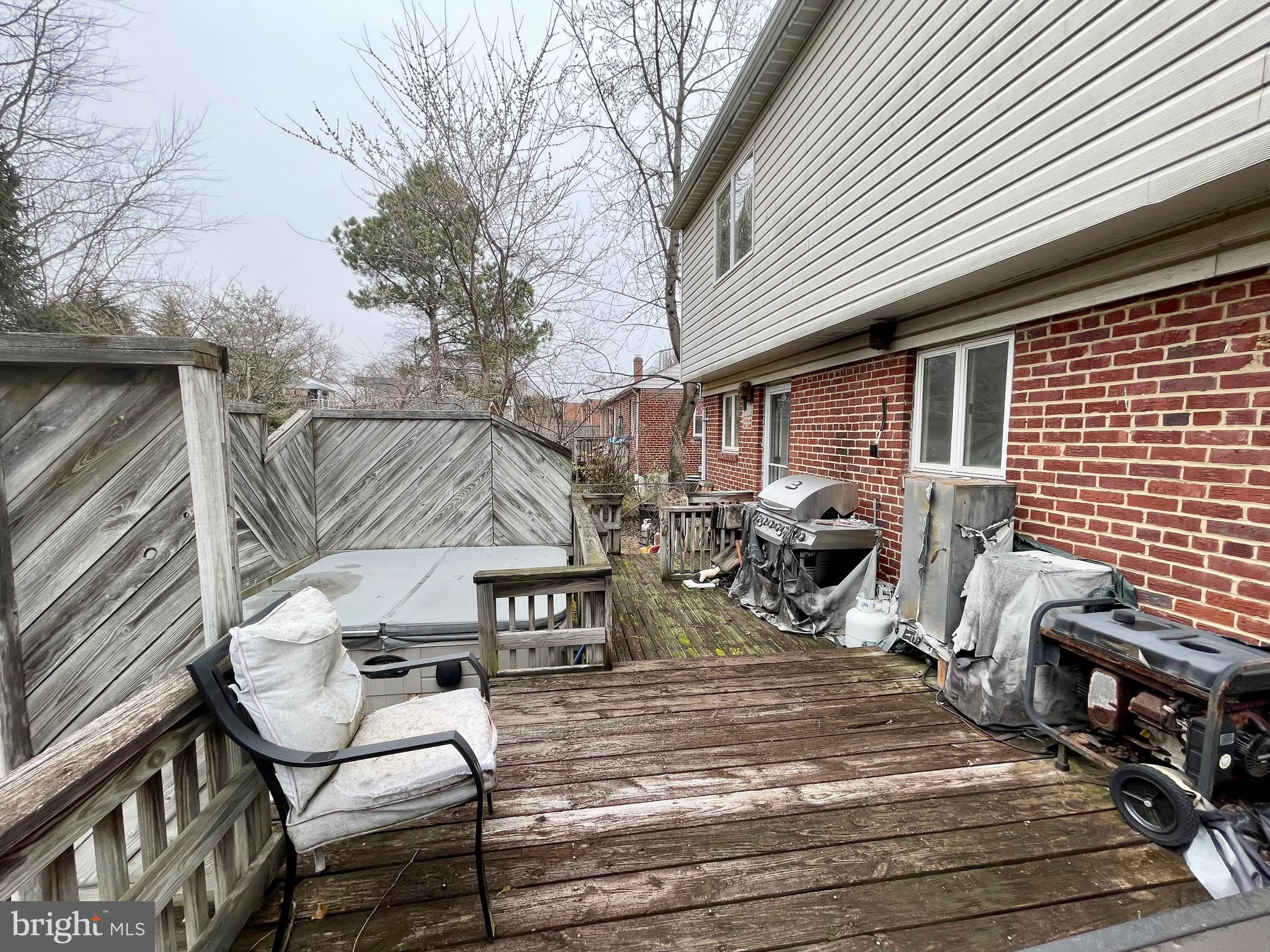 12420 Feldon Street Silver Spring, MD 20906 - Photo 30 of 33 a view of a patio with table and chairs with wooden floor and fence