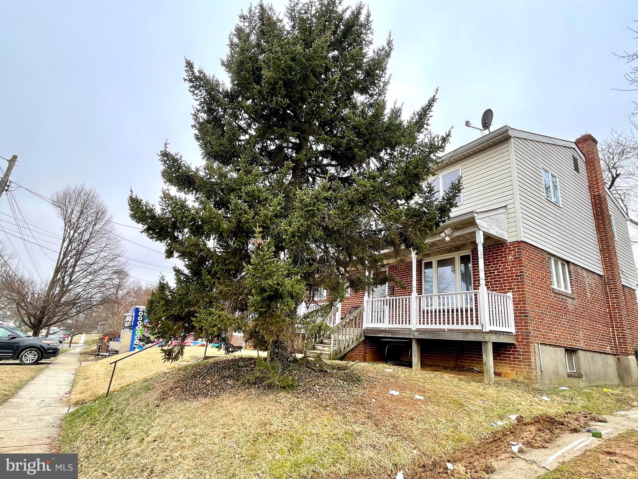 12420 Feldon Street Silver Spring, MD 20906 - Photo 3 of 33 a front view of a house with a yard