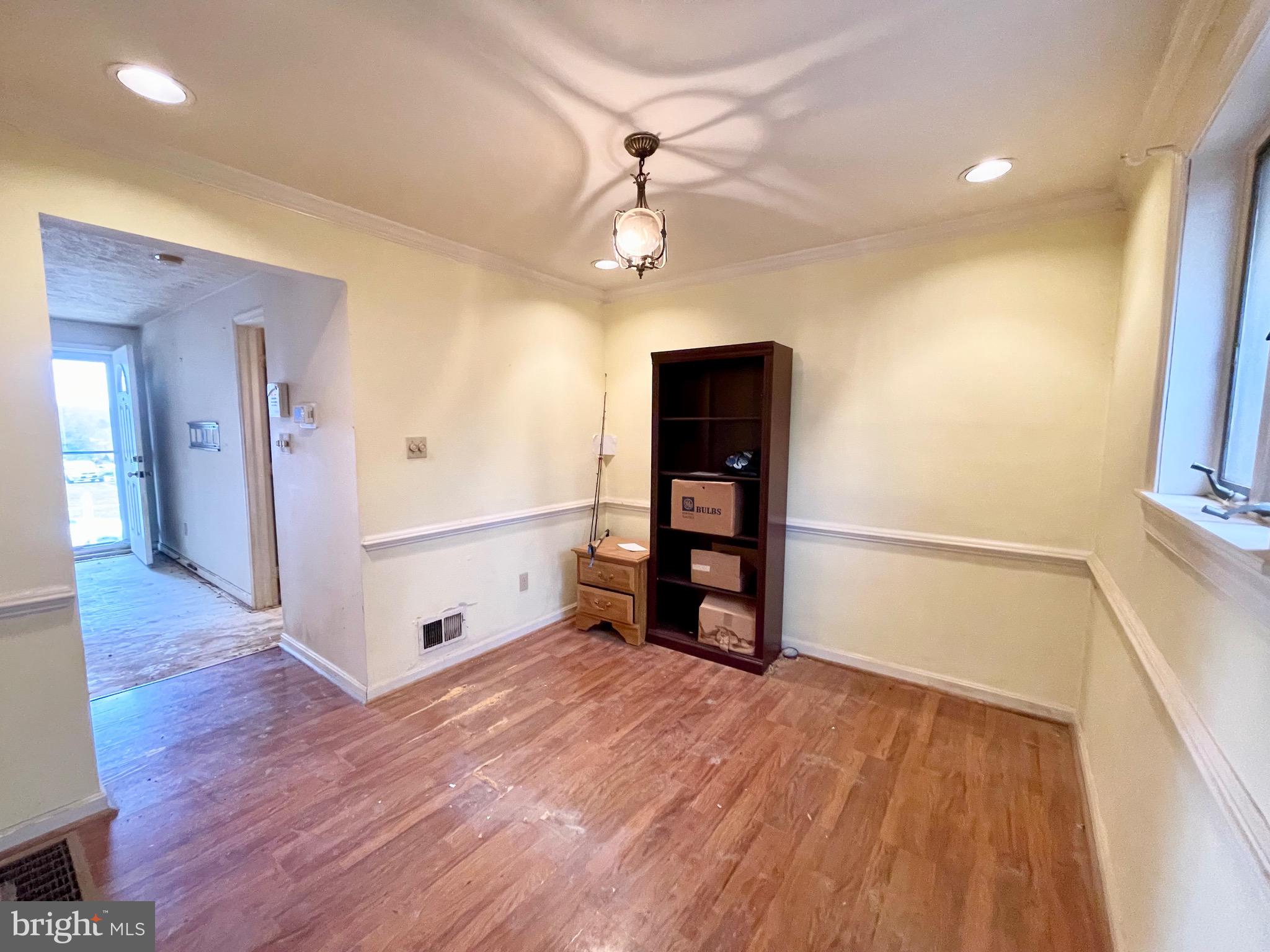 12420 Feldon Street Silver Spring, MD 20906 - Photo 6 of 33 wooden floor in an empty room with a window