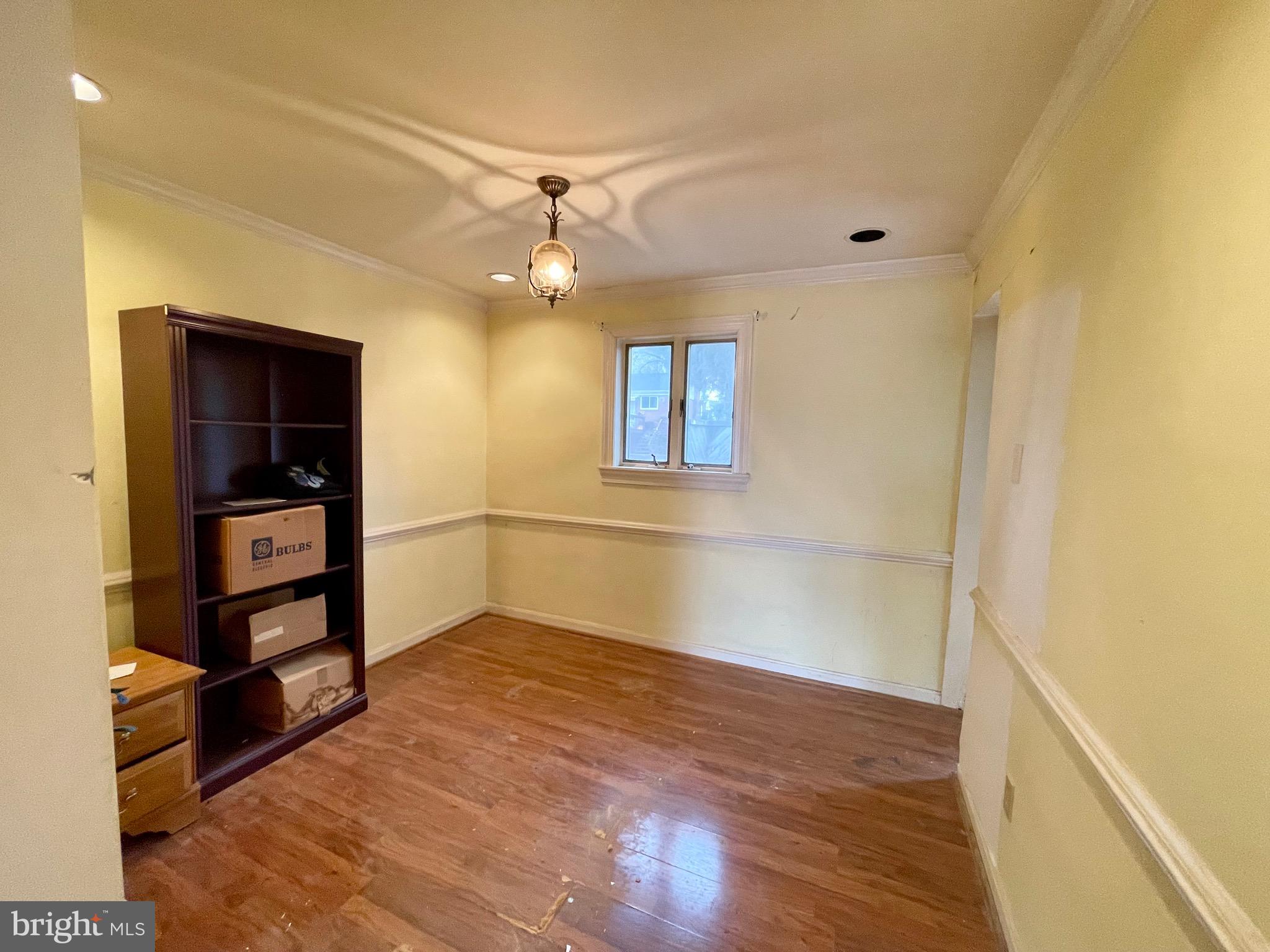 12420 Feldon Street Silver Spring, MD 20906 - Photo 7 of 33 wooden floor in an empty room with a window