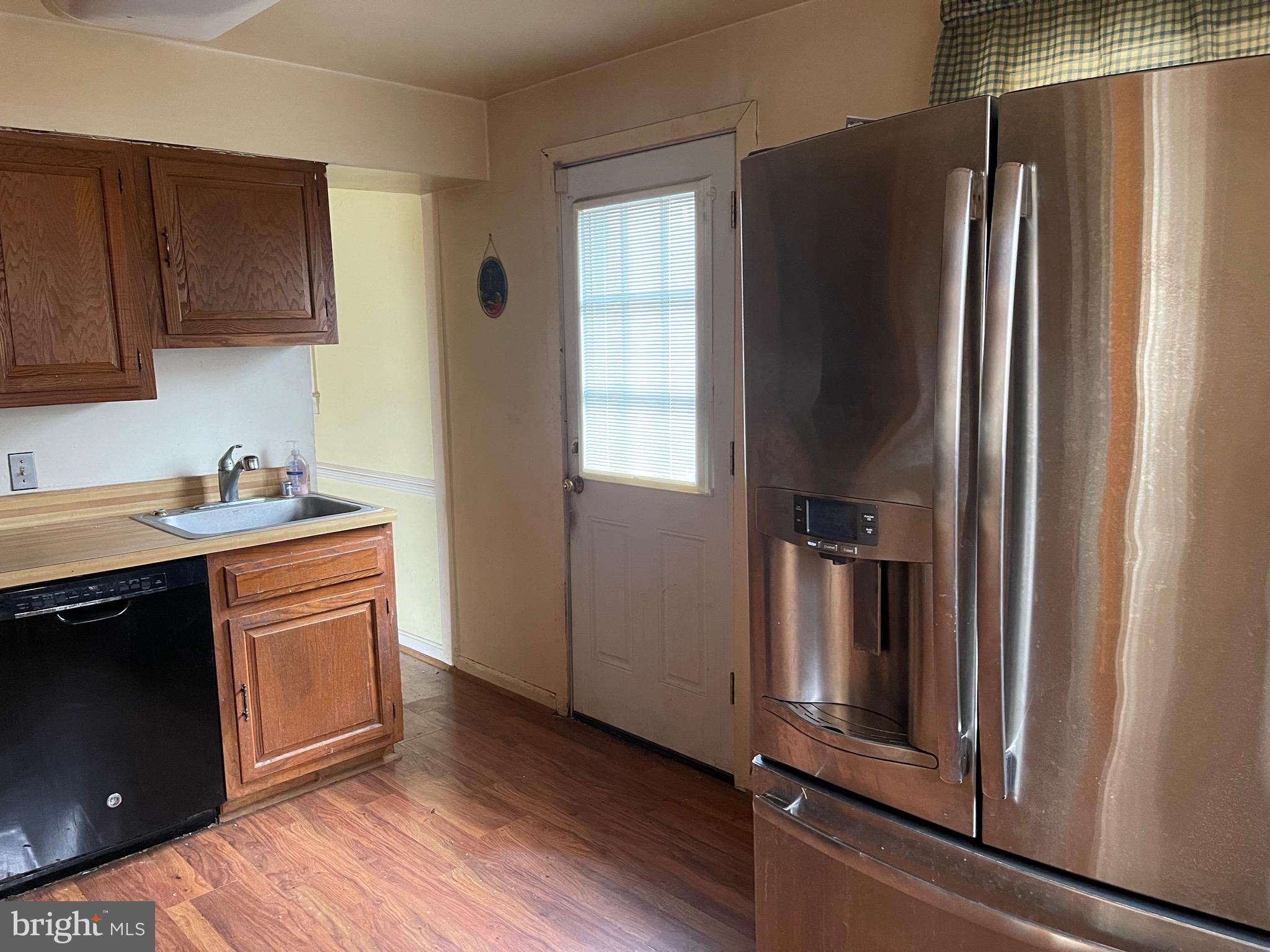 12420 Feldon Street Silver Spring, MD 20906 - Photo 8 of 33 a kitchen with stainless steel appliances granite countertop a refrigerator and a stove top oven