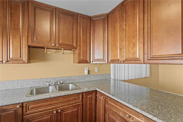 a kitchen with a sink and cabinets