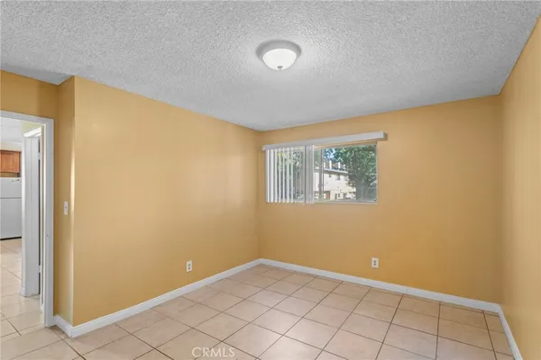 a view of an empty room with windows