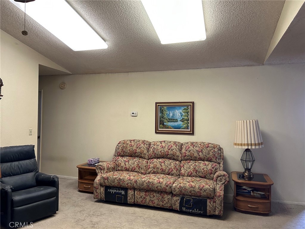 27250 Murrieta Road, Unit 347 Menifee, CA 92586 - Photo 14 of 39 a living room with furniture a couch and a window