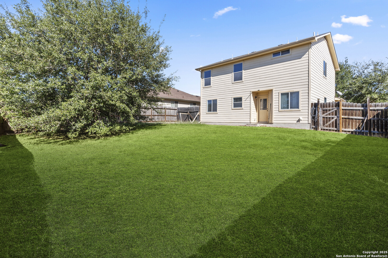 3917 Whisper Ridge Schertz, TX 78108 - Photo 25 of 27 a view of a house with a backyard