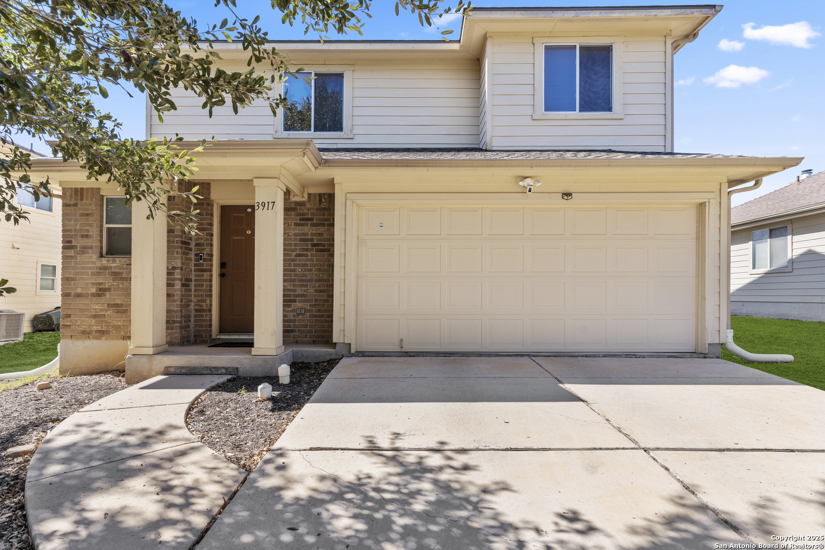 3917 Whisper Ridge Schertz, TX 78108 - Photo 3 of 27 a front view of a house with a yard