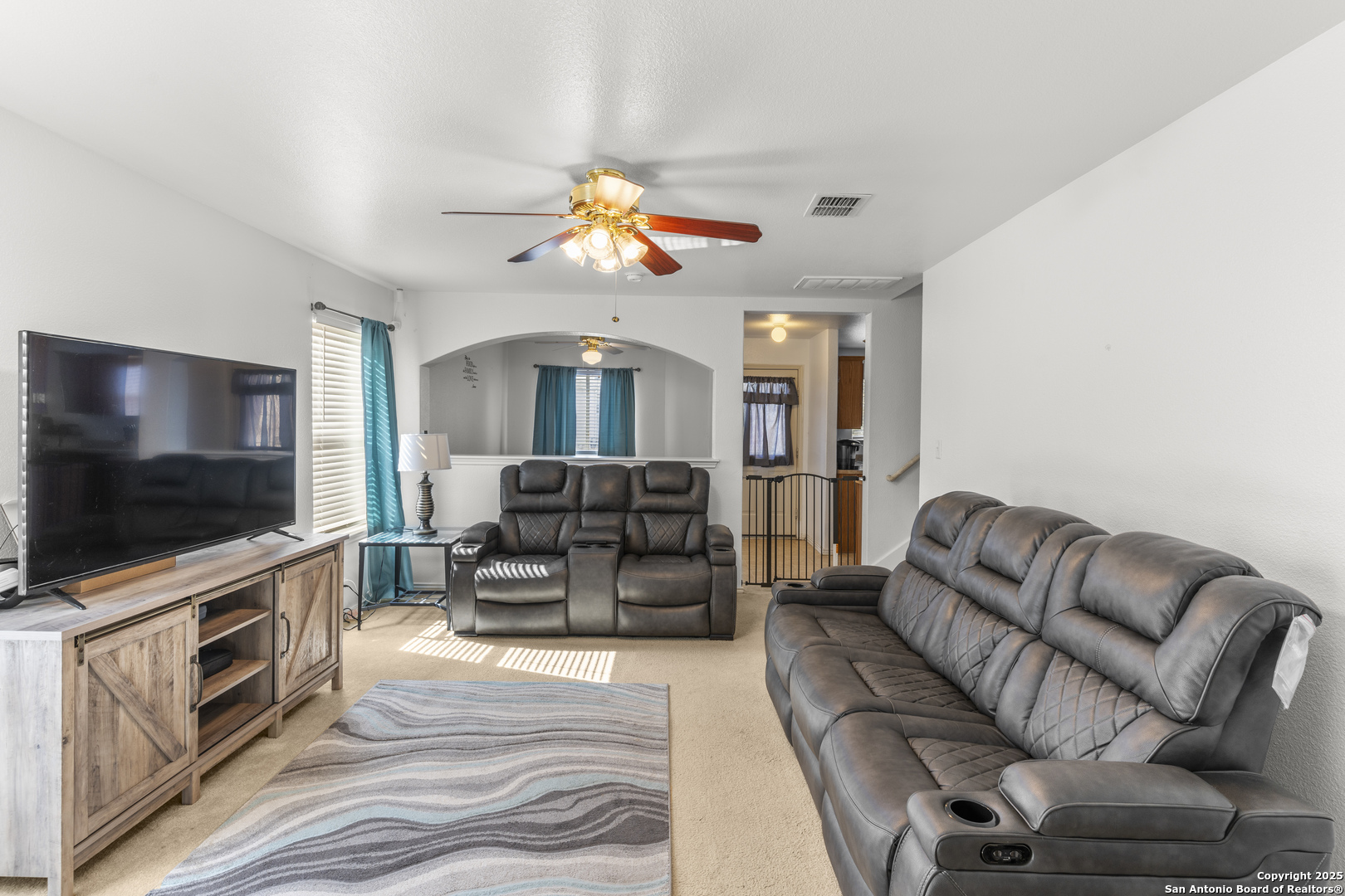 3917 Whisper Ridge Schertz, TX 78108 - Photo 4 of 27 a living room with furniture and a flat screen tv