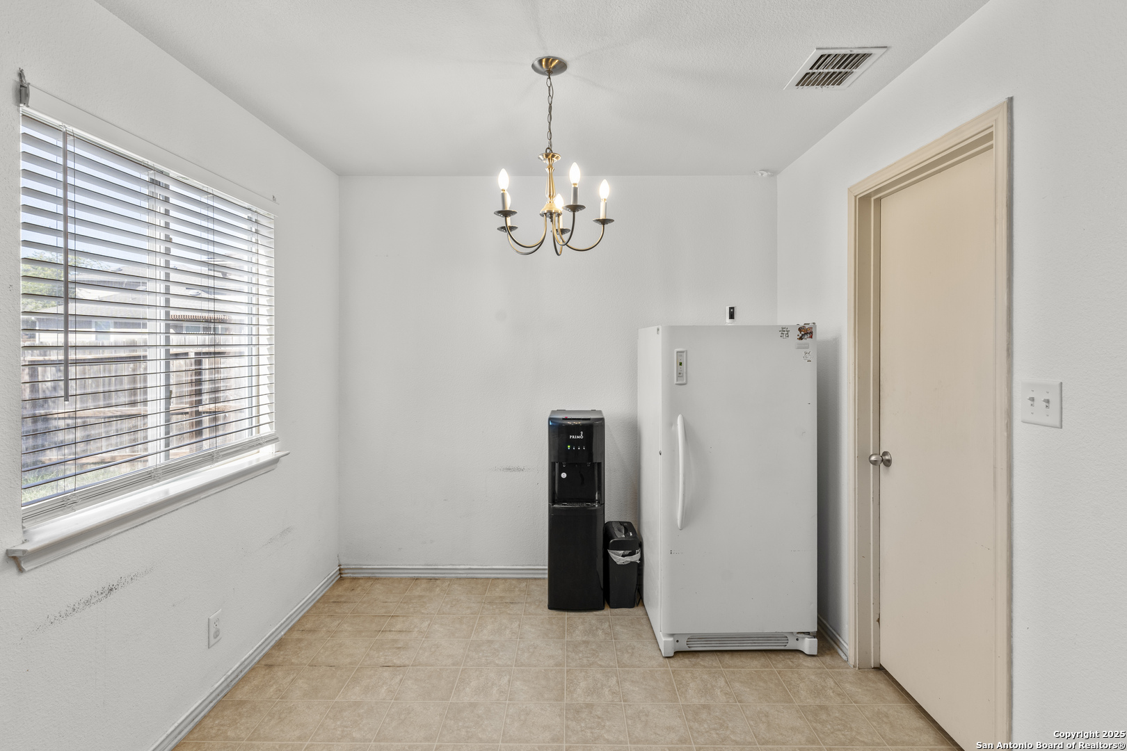 3917 Whisper Ridge Schertz, TX 78108 - Photo 9 of 27 a view of an empty room with chandelier fan