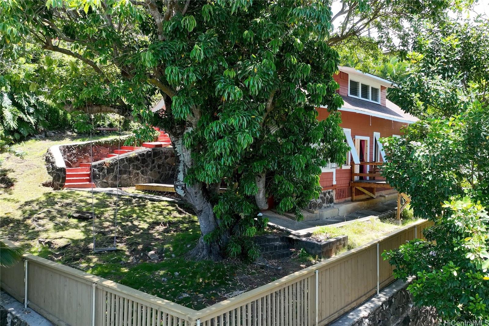 2441 Pacific Heights Road Honolulu, HI 96813 - Photo 1 of 1 a view of a wooden house with a yard
