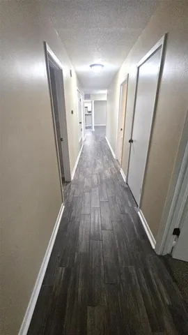 a bathroom with a sink mirror vanity and toilet