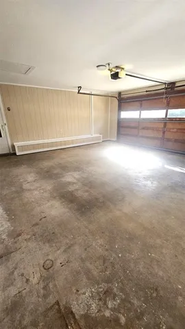 a view of a house with a patio and a garage