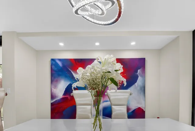 a bedroom with bed and a flat screen tv