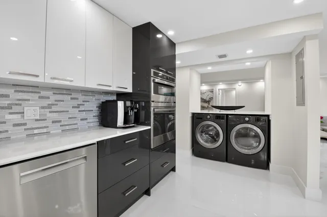 a bathroom with a sink vanity tub and shower