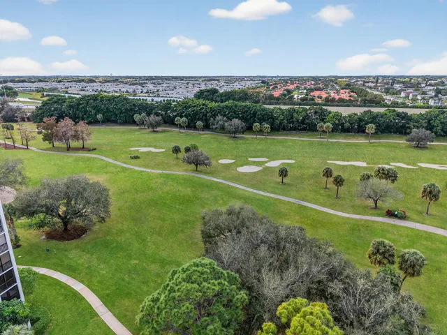 a very nice looking living room with furniture and a large window