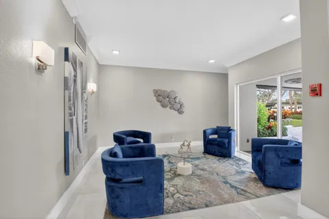 a living room with furniture a fireplace and walls