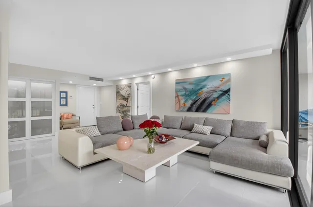 a kitchen with stainless steel appliances kitchen island granite countertop a refrigerator stove and sink