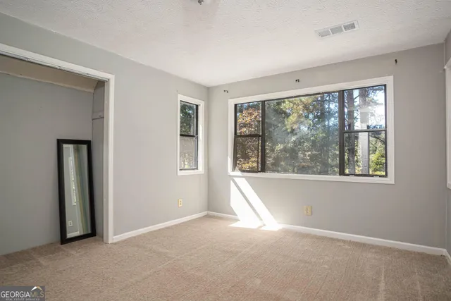 an empty room with windows