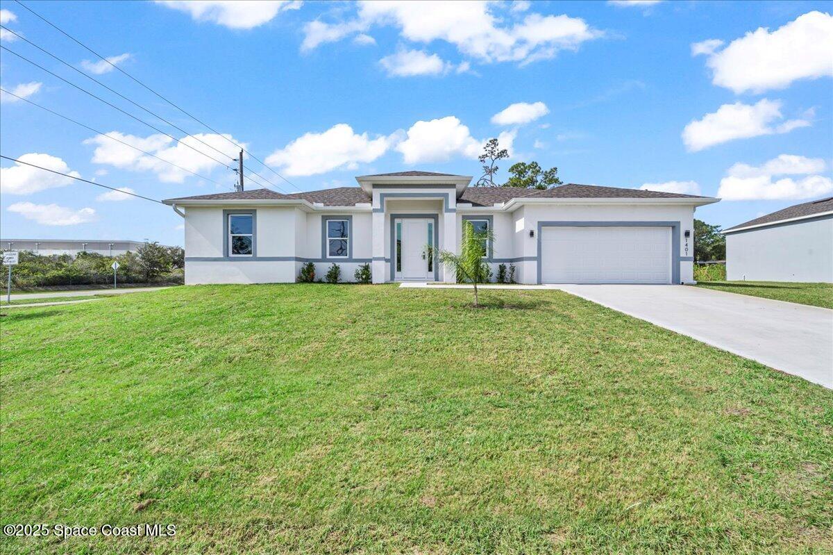 1401 Wilder Road Palm Bay, FL 32909 - Photo 1 of 21 a large tree in front of house with yard