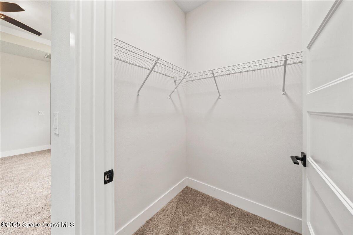 1401 Wilder Road Palm Bay, FL 32909 - Photo 11 of 21 a view of a room with racks on the wall