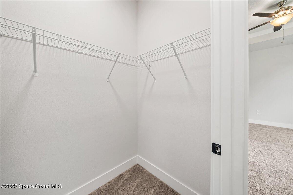 1401 Wilder Road Palm Bay, FL 32909 - Photo 12 of 21 a view of a room with racks on the wall