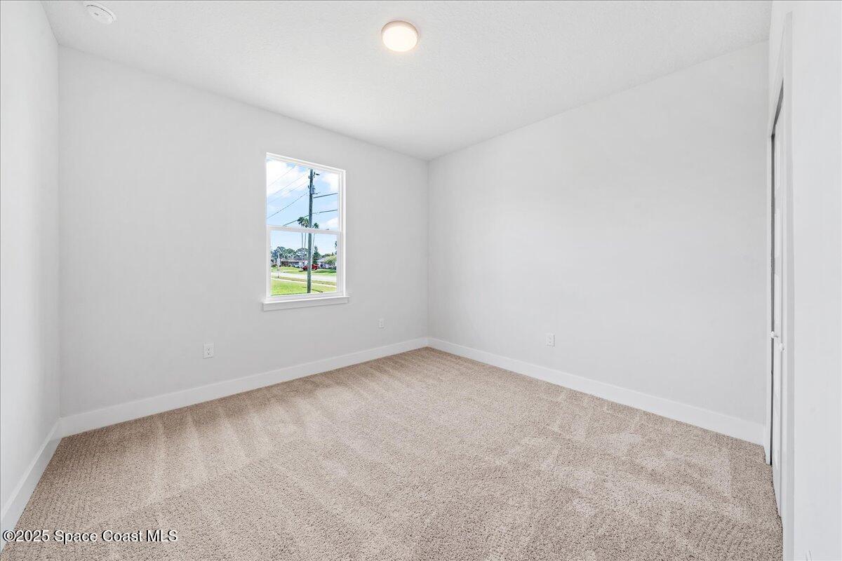 1401 Wilder Road Palm Bay, FL 32909 - Photo 16 of 21 an empty room with windows