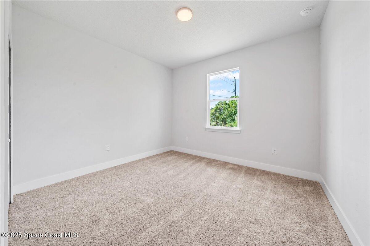 1401 Wilder Road Palm Bay, FL 32909 - Photo 17 of 21 an empty room with window