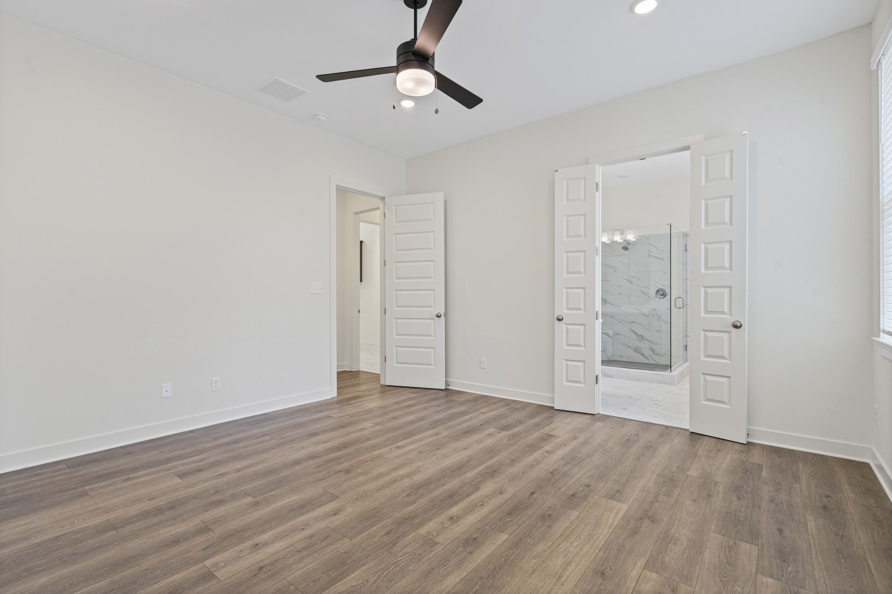 5702 Gerber Road Arlington, TN 38002 - Photo 11 of 27 Spacious room featuring wood-finish flooring, recessed lighting, and a contemporary ceiling fan