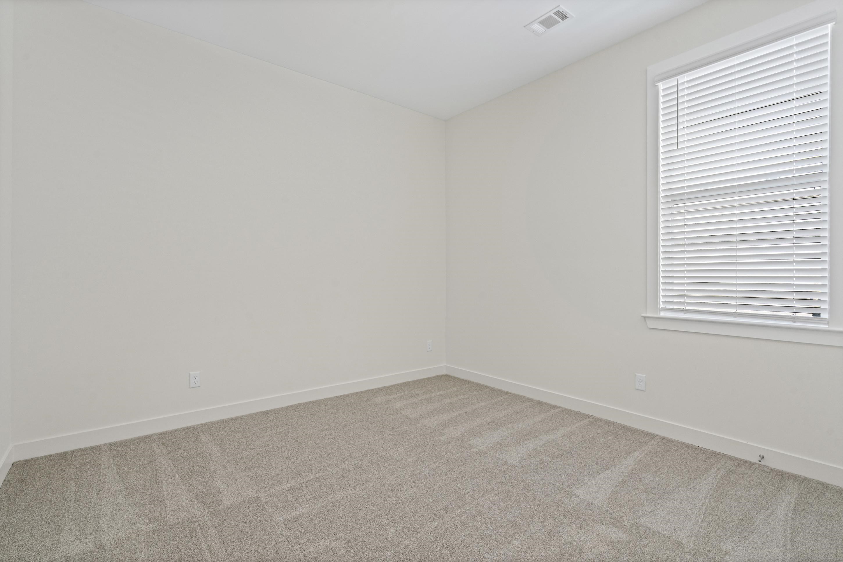 5702 Gerber Road Arlington, TN 38002 - Photo 15 of 27 Neutral-toned walls complement the light gray carpet flooring