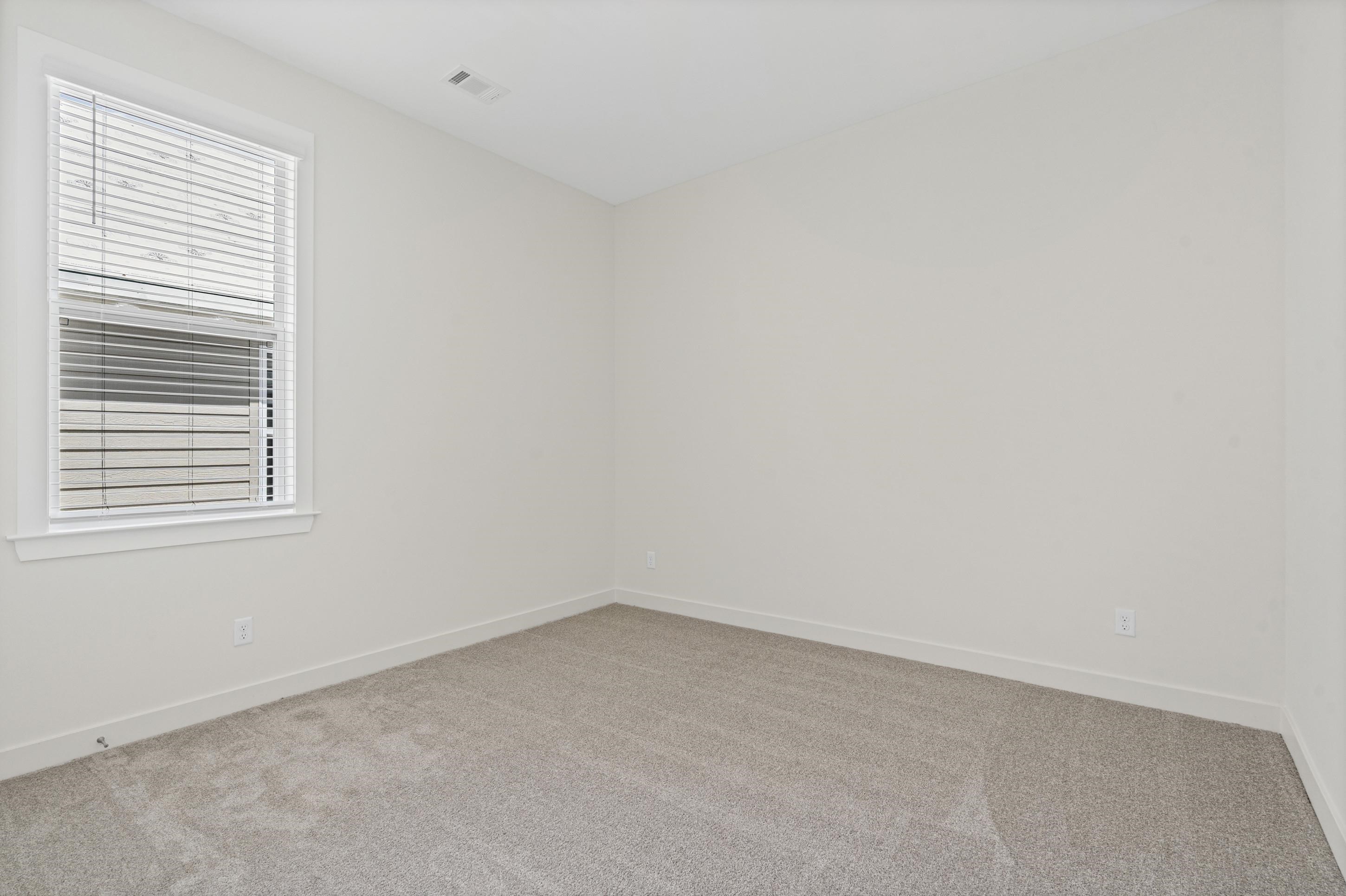 5702 Gerber Road Arlington, TN 38002 - Photo 18 of 27 Bright room featuring a single window, neutral-toned walls, and plush carpeting