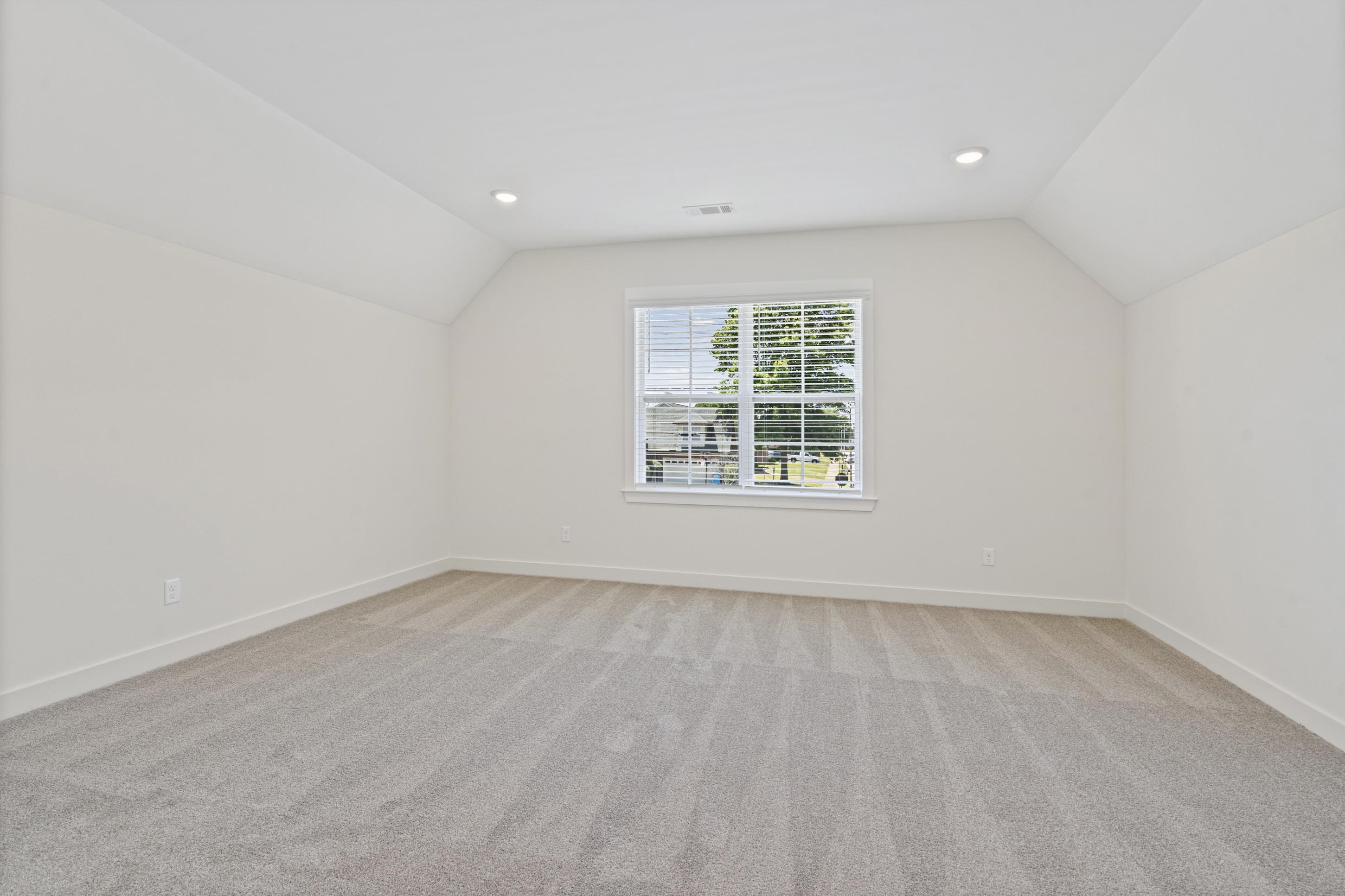 5702 Gerber Road Arlington, TN 38002 - Photo 21 of 27 Spacious room with sloped ceilings and recessed lighting