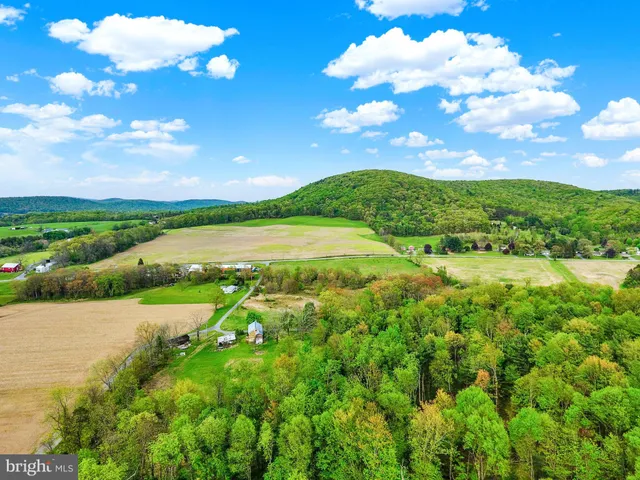 a view of an lake and a yard