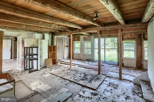 a living room with lots of furniture and a rug