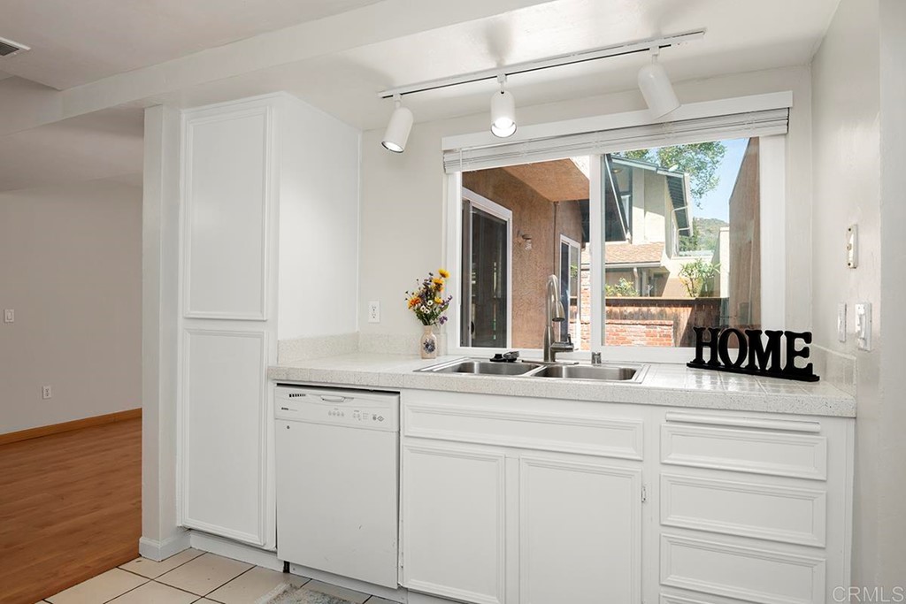 10281 Alphonse Street Santee, CA 92071 - Photo 12 of 26 a bathroom with a sink and a mirror