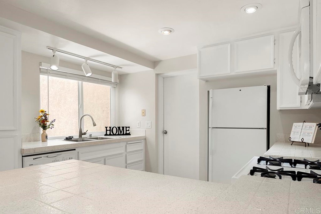 10281 Alphonse Street Santee, CA 92071 - Photo 13 of 26 a room with a bed a large window and furniture