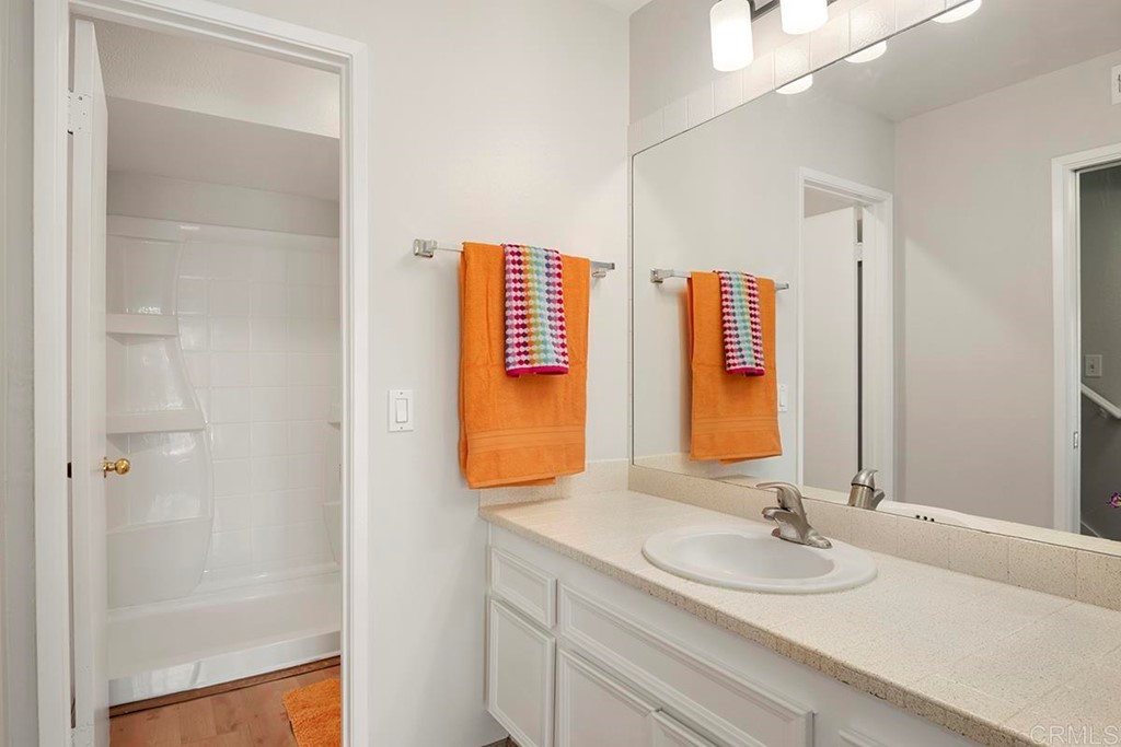 10281 Alphonse Street Santee, CA 92071 - Photo 16 of 26 a bathroom with a granite countertop sink and a mirror